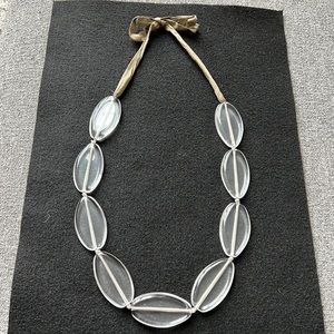 Maria Calderara Lucite Necklace, in very condition. The cord is a greeny/bronze